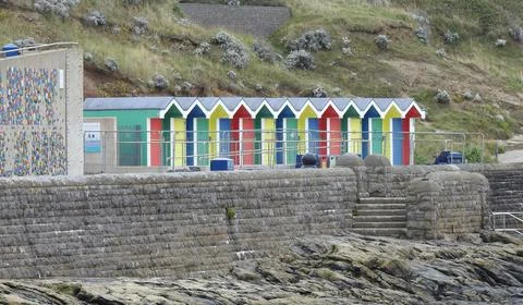 Beach huts on the coast Stock Photos