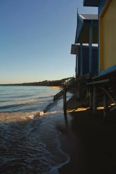 Beach Huts at High-Tide Foto stock