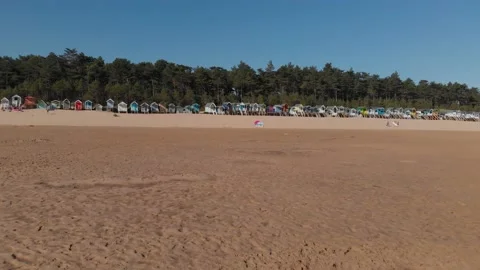 Beach Huts, Sand, Wells-Next-The-Sea Slow Rise Aerial UK Norfolk Coastline Stock Footage 138015853