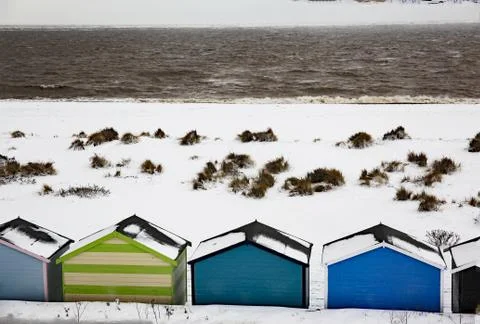 Beach huts in snow Pakefield Suffolk uk 4 Stock Photos