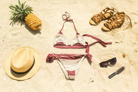 Beach image: sandals, bikini, hat and glasses Stock Photos