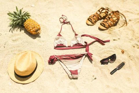Beach image: sandals, bikini, hat and glasses Stock Photos