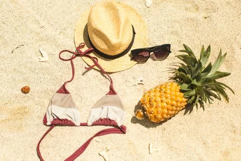 Beach image: sandals, bikini, hat and glasses Stock Photos