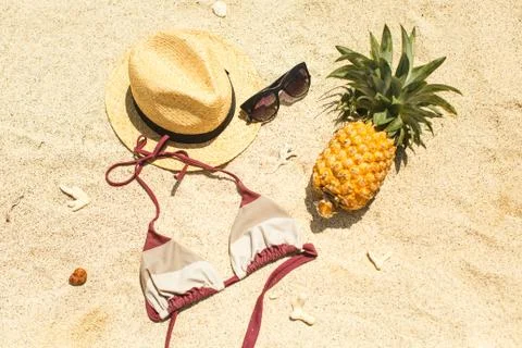 Beach image: sandals, bikini, hat and glasses Stock Photos
