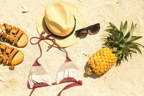 Beach image: sandals, bikini, hat and glasses Stock Photos