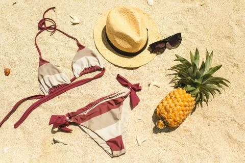 Beach image: sandals, bikini, hat and glasses Stock Photos