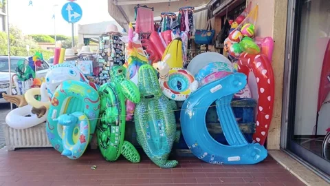 Beach inflatables and items in Marina di Carrara, Italy, August 24, 2026 Stock Footage 343420322
