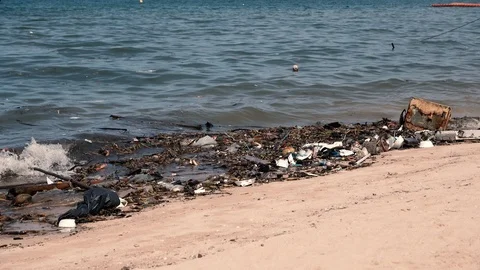 Beach invaded by garbage, pollution of the sea Stock-Footage 86428964
