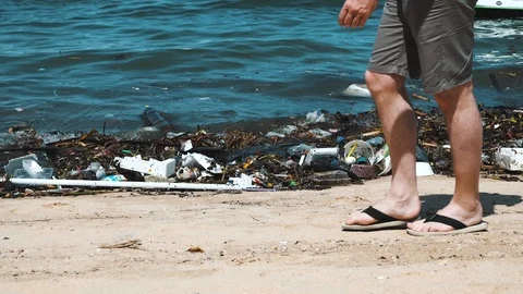 Beach invaded by garbage, pollution of the sea Stock-Footage 86472854