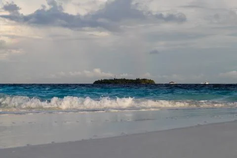 The beach on an island with waves Stock Photos