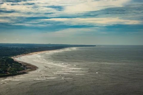 Beach isolated in aerial shots with dramatic sky 스톡 사진
