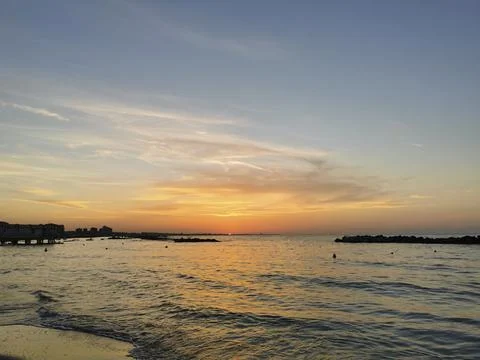 Beach in Italy's Romagna Riviera at sunset Foto stock
