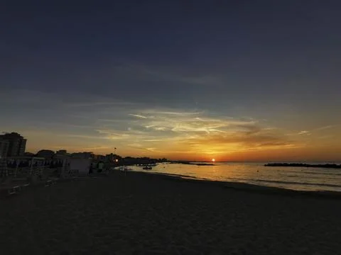 Beach in Italy's Romagna Riviera at sunset Stock Photos