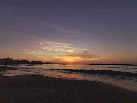 Beach in Italy's Romagna Riviera at sunset Stock Photos
