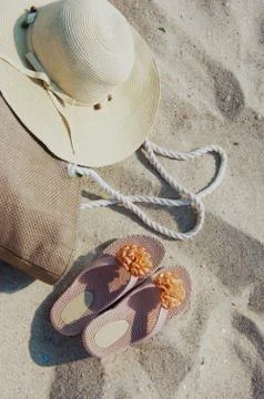 Beach items lying on sand Stock Photos