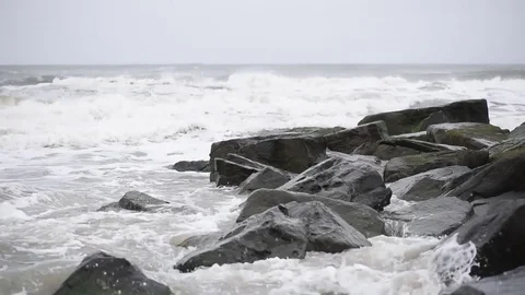 Beach jetty storm surge Stock Footage 75770489