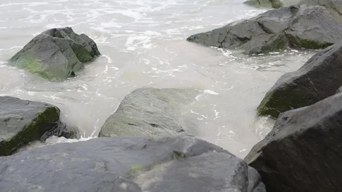 Beach jetty surf high water gentle waves Stock Footage 75763812