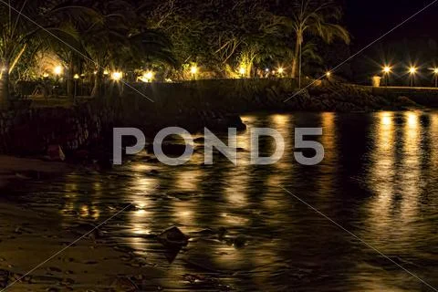 Beach jungle night time lapse flame torches Stock Photos