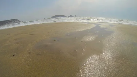 Beach landscape with big waves and bubbles on the sand Video stock 117632212