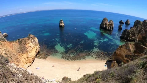 Beach landscape at Lagos, Portugal. Beach with blue sea and white sand. Stock Footage