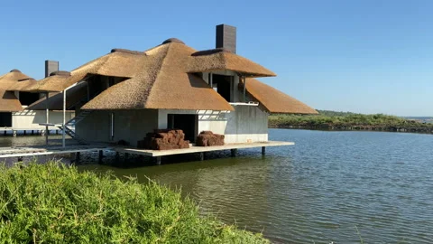 Beach landscape with river, sky and house on the water in summer day Video stock 137645272