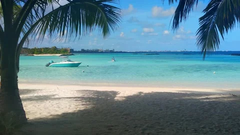 Beach landscape. Sandy Beach with boat in the Maldives. 스톡 동영상 168515851
