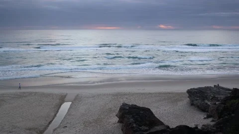 Beach Landscape Shot - Woman Jogging Across Scene Stock Footage