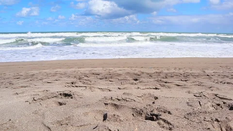 Beach with large waves slow motion Stock Footage 166844292