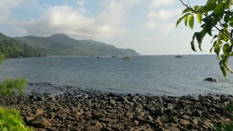 Beach on Lemukutan Island with a mountain backdrop Stock Footage 312657488