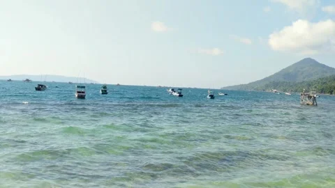 Beach on Lemukutan Island with a mountain backdrop Stock Footage 312658193