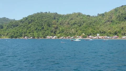 Beach on Lemukutan Island with a mountain backdrop Stock Footage 312661694