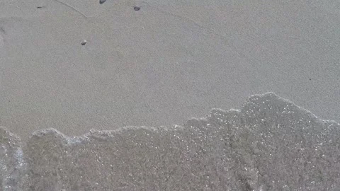 Beach, lettering 2021 on the sand, the wave begins to cover the numbers, summer Stock Footage