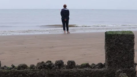 Beach life fun on the sand playing in the low tide adults and children Video stock 137578633