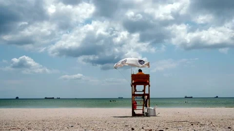 Beach lifeguard on duty Stock Footage 134029910