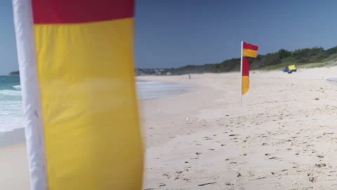 Beach with Lifeguard Flags CU (pull focus) 005 Video stock 170344254