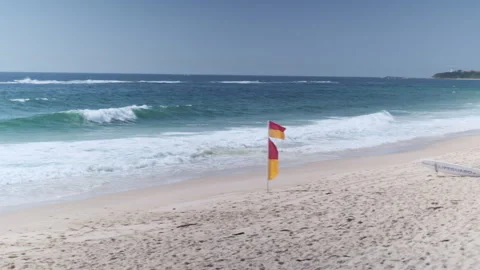 Beach with Lifeguard Flags MS (pan) 001 Video stock 170344055