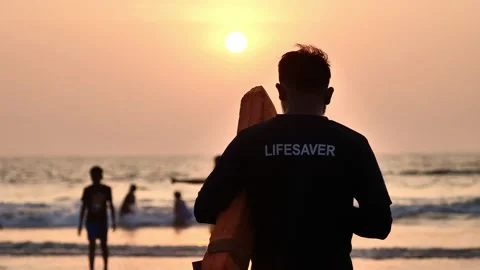 Beach lifeguard keeps order in the ocean Video stock 259719814