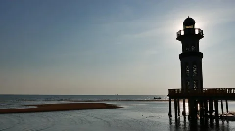 A beach with lighthouse at day light Stock Footage 50794928