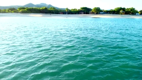 A beach with a lighthouse in the distance Video stock 293689668