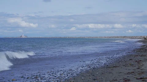 Beach with lighthouse Stock Footage 87949642
