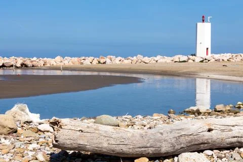 Beach with lighthouse, tuscany Stock Photos