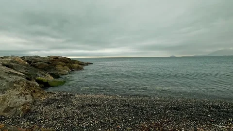 Beach on the Ligurian Sea on a cloudy day Stock Footage 288488341