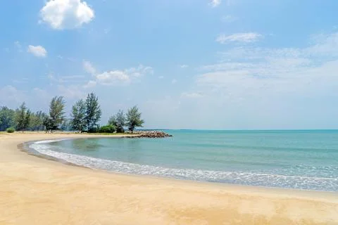 Beach is a long stretch with waves. Stock Photos