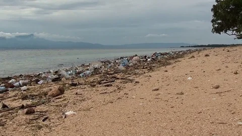 Beach with a lot of plastic waste Video stock 104045077