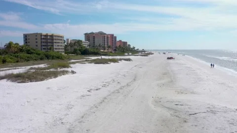 Beach low zoom through beach with hotels Stock Footage 156403284
