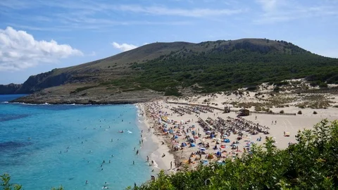 Beach in Mallorca between the mountains in Cala Mesquida Mallorca Spain Video stock 81047316