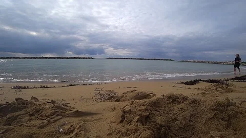 By the beach with a man running Stock Footage 188440164