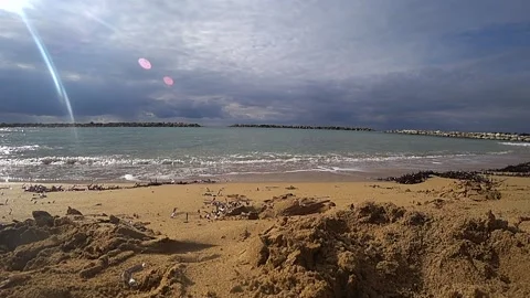 By the beach with a man running in the water Stock Footage 185866860