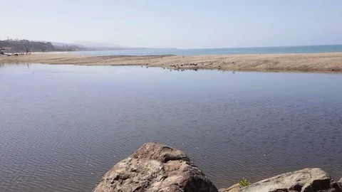 Beach Morning Pond - PANNING UP VERSION TWO Stock Footage 76915413