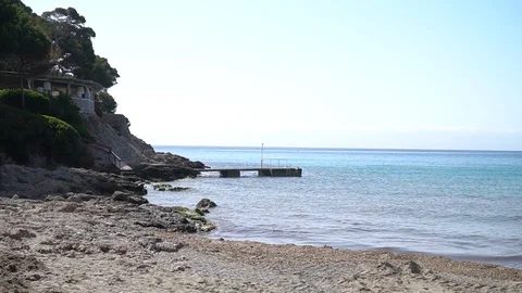 Beach, mountain and dock Stock Footage 128349525